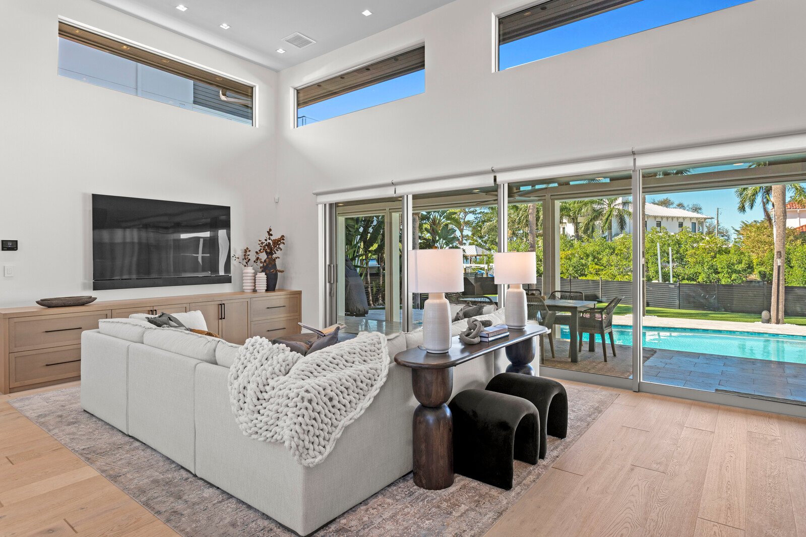 Great room open to the pool at a Crescent waterfront home in Beach Park