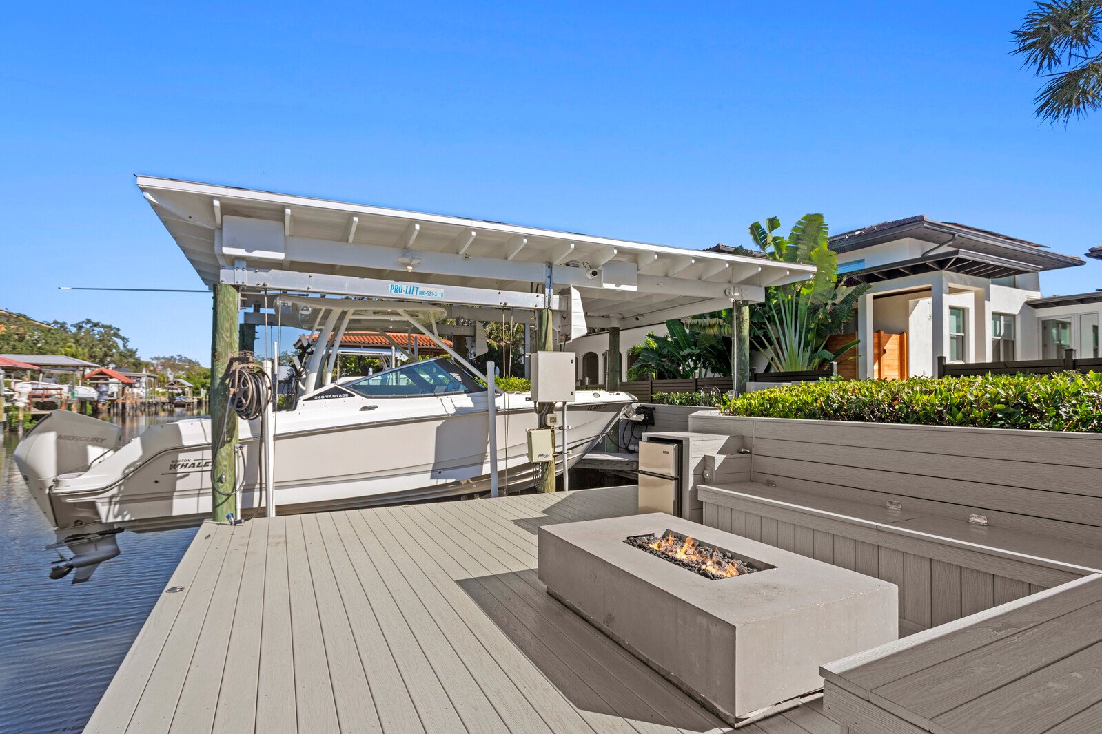 Dock and fire pit at a Crescent waterfront home in Beach Park